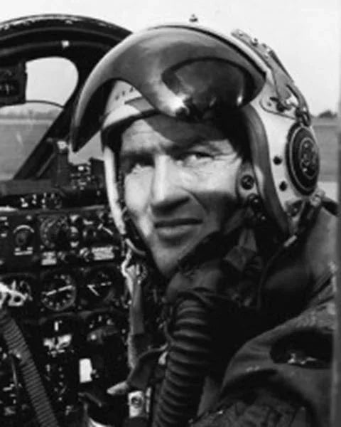 A photograph of Maj. George E. "Bud" Day in the cockpit of his F-100 Super Sabre aircraft.