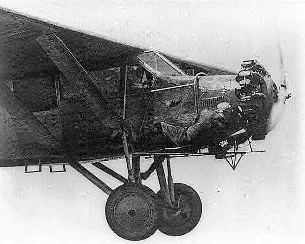 Kenneth Hunter makes repairs to the “City of Chicago” in mid-flight during their world record setting flight of 23 days.