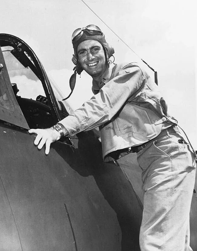 Kepford poses by the cockpit of an F4U after his second combat tour.