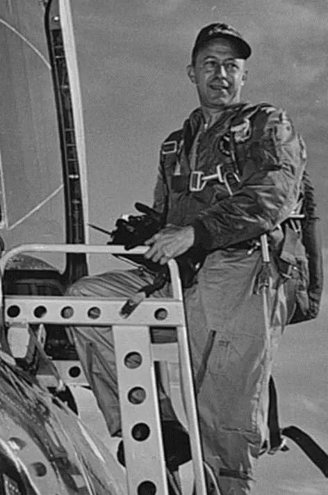Major Adrian E. Drew, U.S. Air Force climbing into a Voodo Jet aircraft.