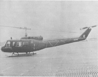 A UH-1 helicopter on a landing pad in Vietnam