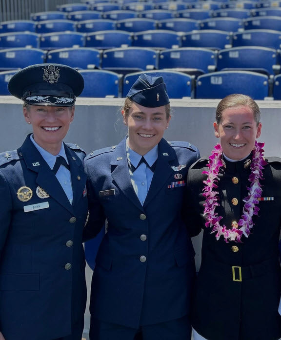 A photograph with USAF Brigadier General  Dana H. Born with her two daughters Air Foce Lt. Hannah and USMC Heather Born