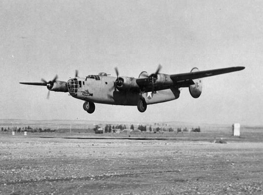 The B-24D, Liberator, Serial Number 41-11819, named "Raunchy", landing at Benghazi, Libya 1943