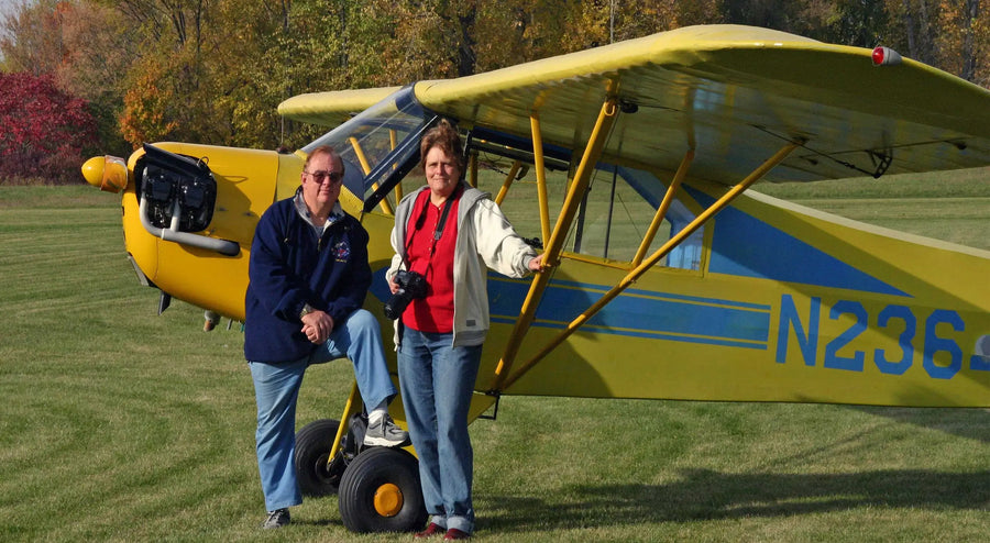 John M. White a/k/a JetAviator7 and partner Betty Alicia in front of a 1941 J-3 Cub Betty owned and flew.