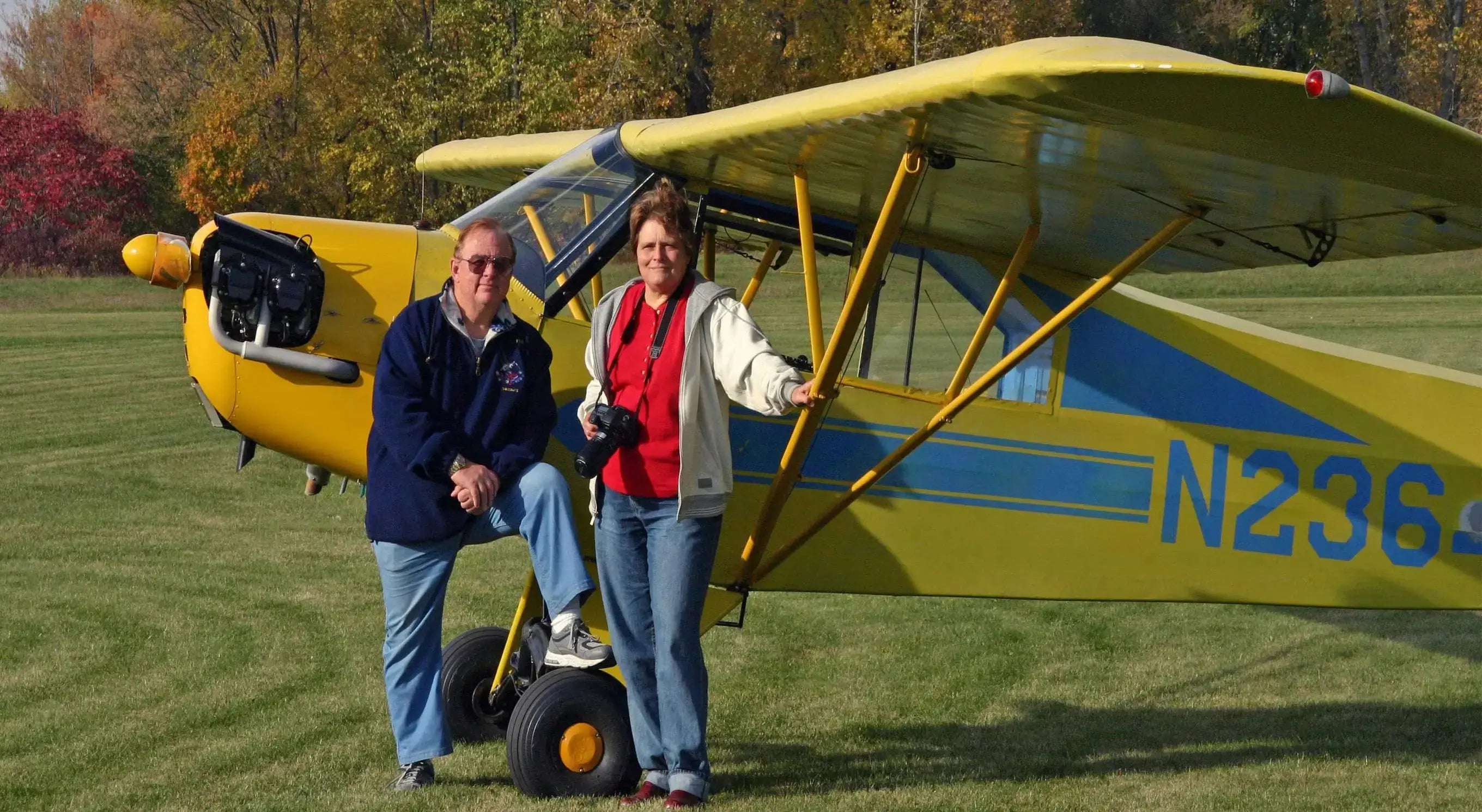 John M. White a/k/a JetAviator7 and partner Betty Alicia in front of a 1941 J-3 Cub Betty owned and flew.