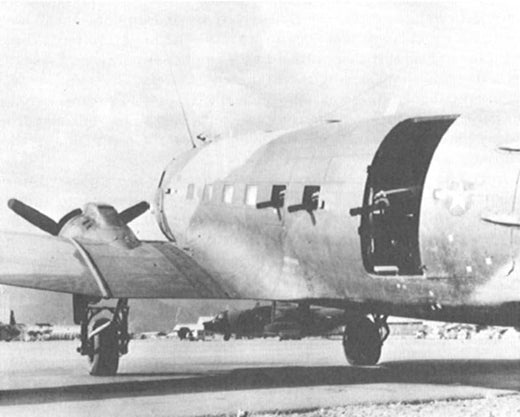 A photo of an AC-47 Gunship with it's MXU-470-A modules on the ramp in South Vietnam during the Vietnam war 
