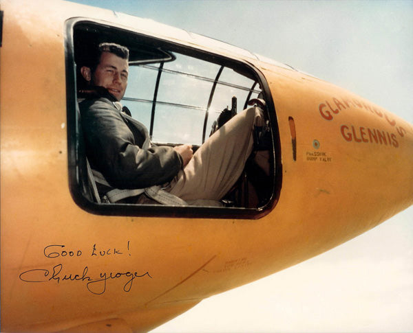 Chuck Yeager sitting in the Bell X-1 rocket plane he became the first man to break the speed of sign