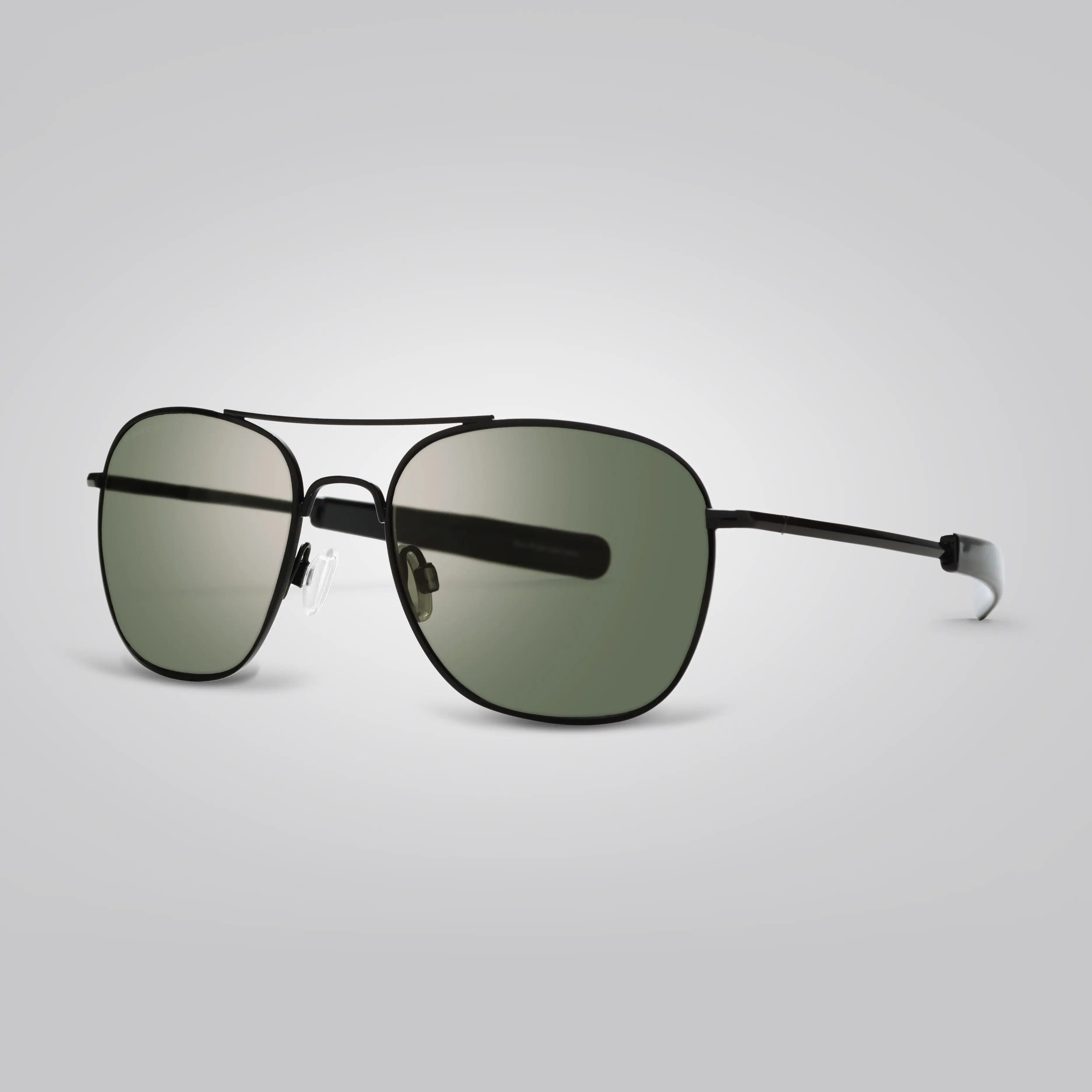 A pair of Eagle Eyes® Black Frame Green Lens Freedom Non-Polarized Pilot Sunglasses in 52, 55 and 57mm Sizes