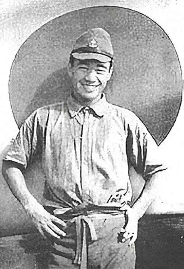 Japanese World War II Ace Saburo Sakai posing in front of the hinomaru (Japanese flag) by his Mitsubishi A5M Type 96 fighter in 1939.