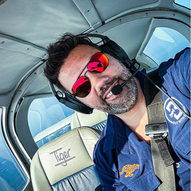 Flying Eyes Pilot Sunglasses. A pilot wearing a pair of Flying Eyes Peregrine Pilot Sunglasses
