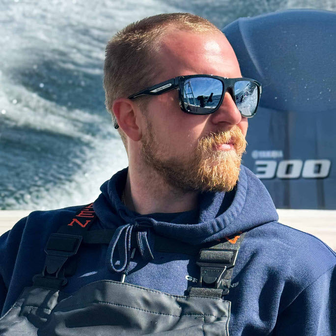 Outdoor sportsman wearing a pair of Scheyden Looper sunglasses on the water.