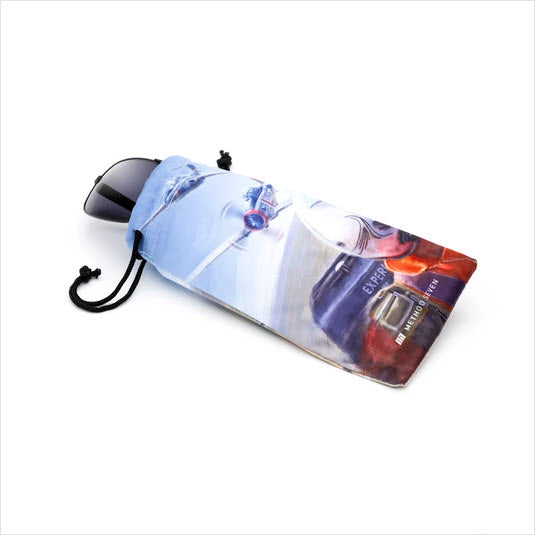 A light blue drawstring pouch with a printed graphic of a vintage airplane , shown on a white background with a pair of Method Seven Patriot sunglasses inside.