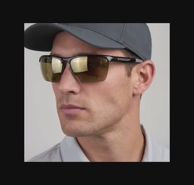 Golfer wearing a pair of Scheyden CIA Grabber golfing sunglasses.